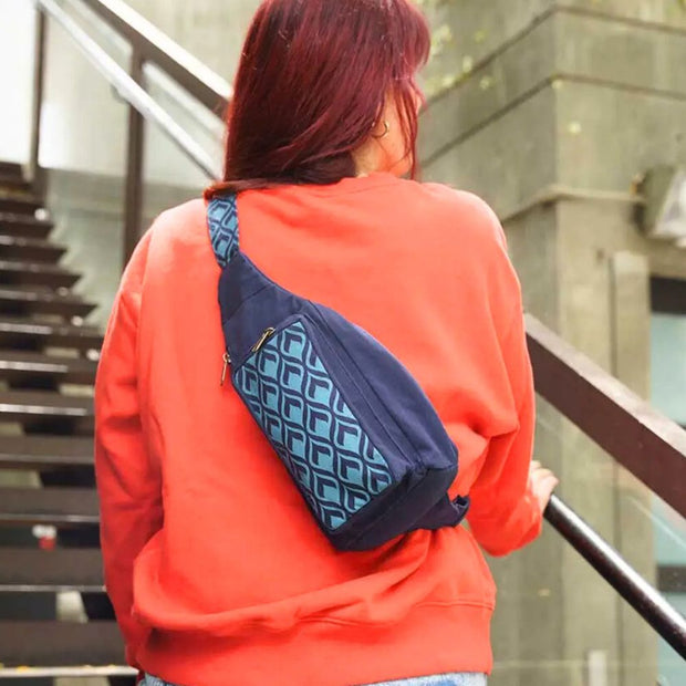 Sling Mini Backpack or Belt Bag with Geometric Navy screen print design on model