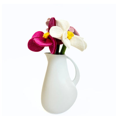 Felt Magnolia Flower Stems in various colors in a ceramic pitcher