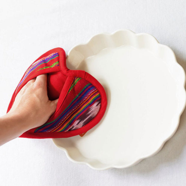 Handwoven Festive Red Heart Shaped Pot Holder in use