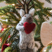 Felt Grey Deer Ornament holding a Heart on a tree