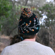 Andes Gifts Hand-knitted Embroidered Flora Winter Hat in Black on model seen from behind