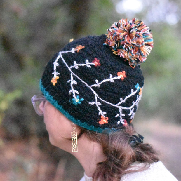 Andes Gifts Hand-knitted Embroidered Flora Winter Hat in Black on model