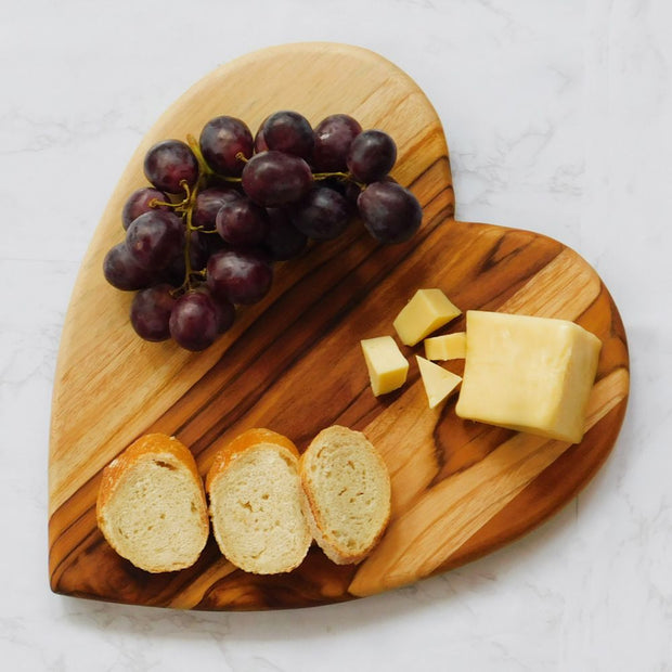 Heart-Shape Teak Wood Serving Board styled with cheese and grapes