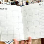 5"x7" Monthly and Weekly  Floral Zodiac Constellation Planner showing interior monthly pages