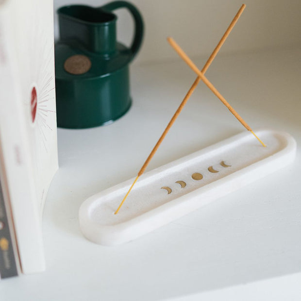 Indukala Moon Phases White Marble Double Incense Holder lifestyle with two incense sticks