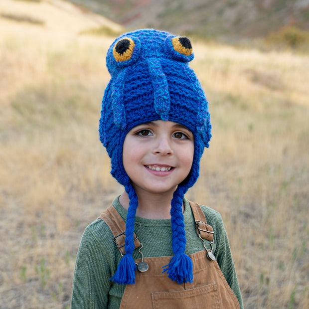 Little kid wearing a Hand-knitted Octopus Hat with ear flaps