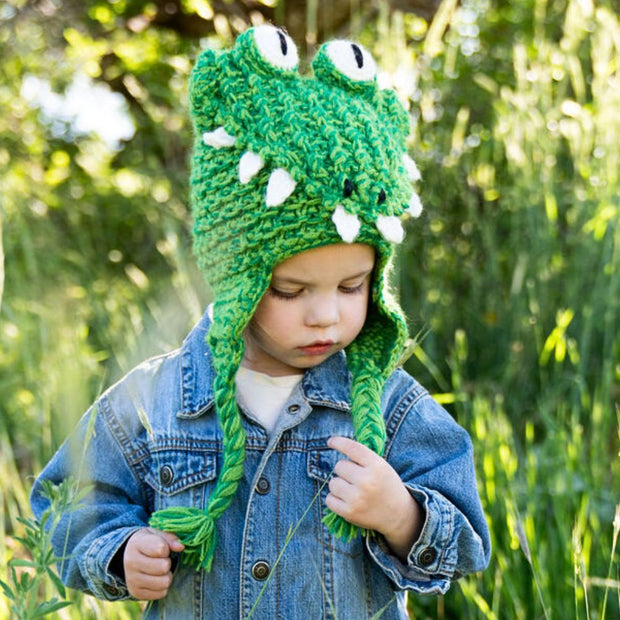 Child wearing a Hand-knit Crocodile Hat by Andes Gifts