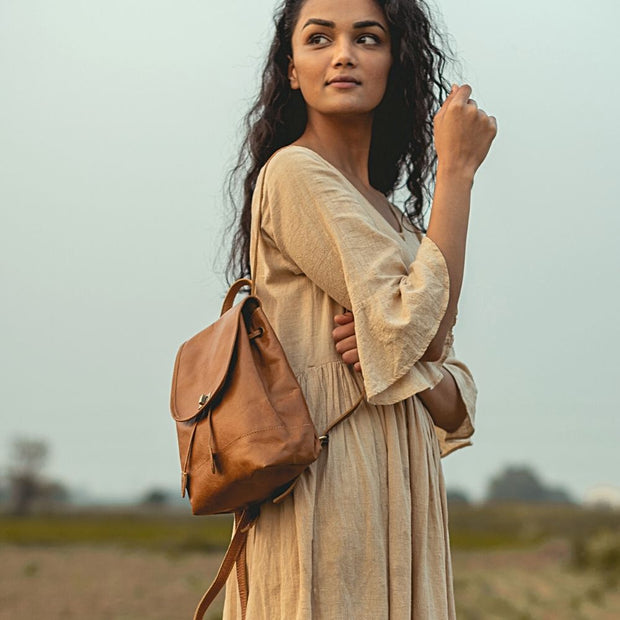 Mini Leather Backpack in Camel color on a model