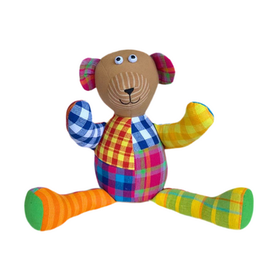 Colorful stuffed bear toy with patchwork plaid pattern 