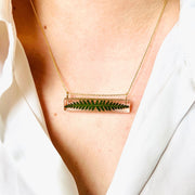 Clear Resin Bar Pendant Necklace with Fern on model