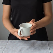 Stoneware Coffee Mug 6.7 oz Matte White held by model