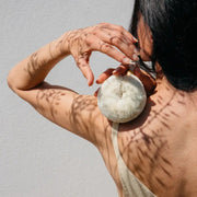 Person holding a Palm Body Eco Max Wash Brush made of Soft Jute