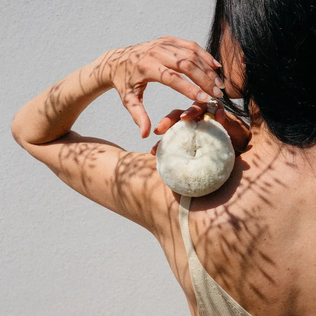 Person holding a Palm Body Eco Max Wash Brush made of Soft Jute