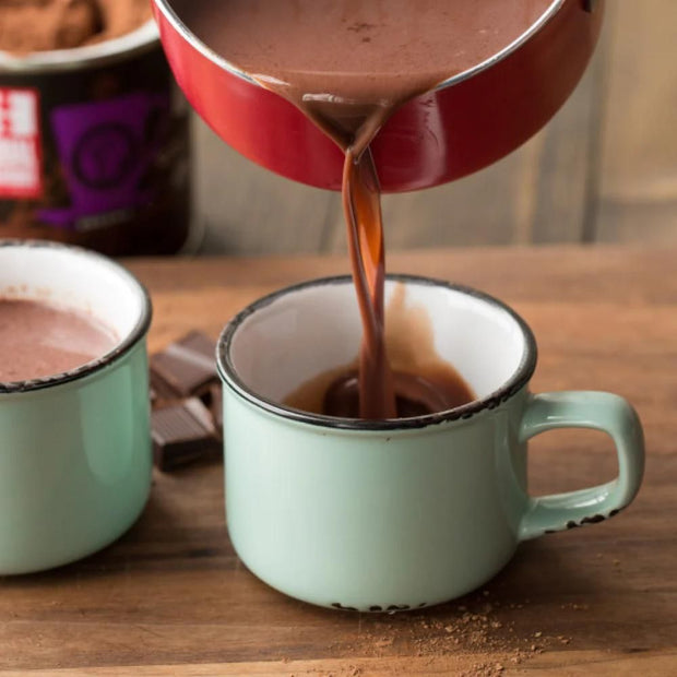 Pouring some Organic Dark Hot Chocolate Mix in a mug