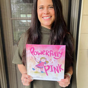 Author Audrey Nixon a copy of her Powerfully Pink Hardcover Book