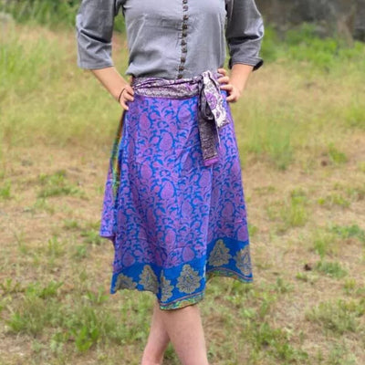 Model wearing a Two-tier reversible recycled silk wrap skirt. One size fits most