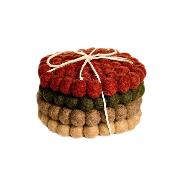 Stack of Four Felt Ball Coasters in Solid Harvest colors with tie