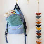 Organic Cotton Small Colorblock Backpack  - Spruce styled on wall