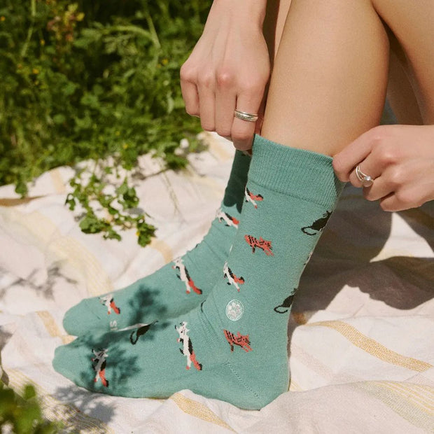 Conscious Step Socks That Save Cats - Teal Frisky Felines on model