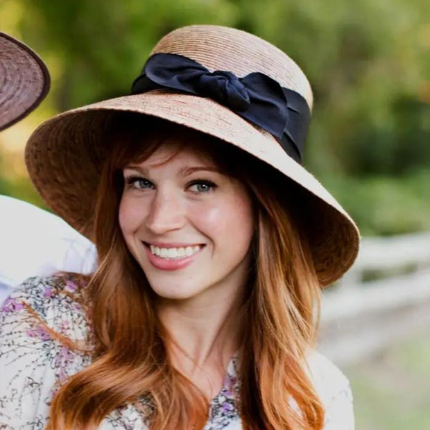 Somerset Black Bow Palm Leaf Tula Hat on female model - bow on side