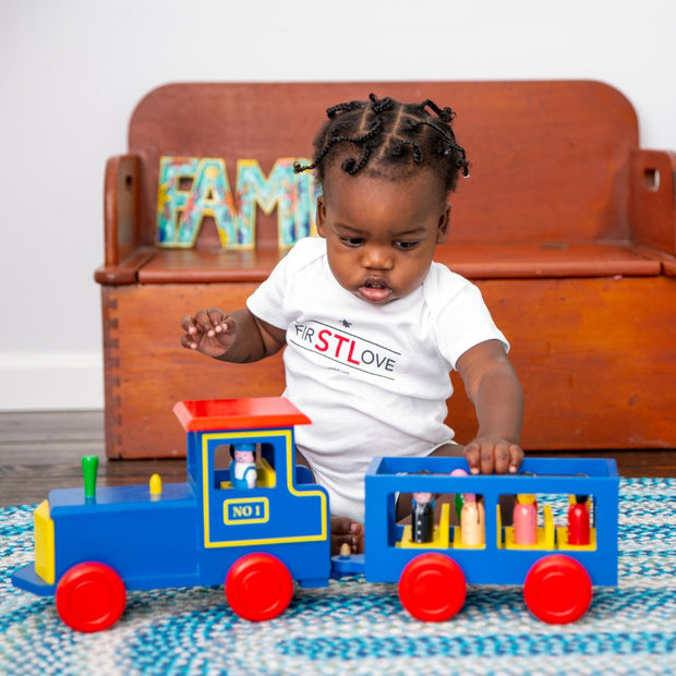 Baby playing with a Train Engine with 8 Passengers and 2 conductors Wooden Toy set