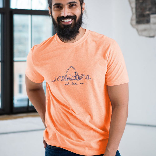 Unisex Short Sleeve Triblend Tee in Orange Sherbet - STL Skyline on male model