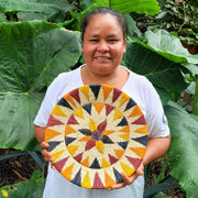 Sunflower Whimsy Handwoven Decorative Basket held by artisan in Peruvian Amazon region