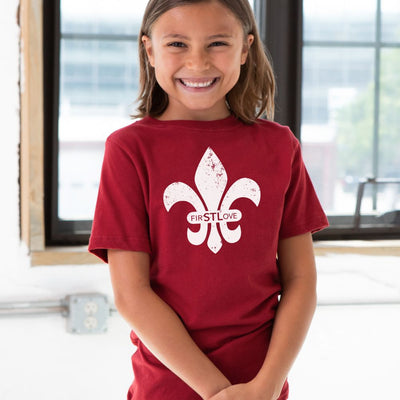 Fleur de Lis Youth Short Sleeve Premium Cotton Tee in Cardinal Red on girl model