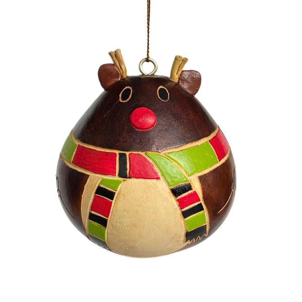 Decorative red nosed reindeer gourd ornament wearing a colorful patchwork pattern on a white scarf