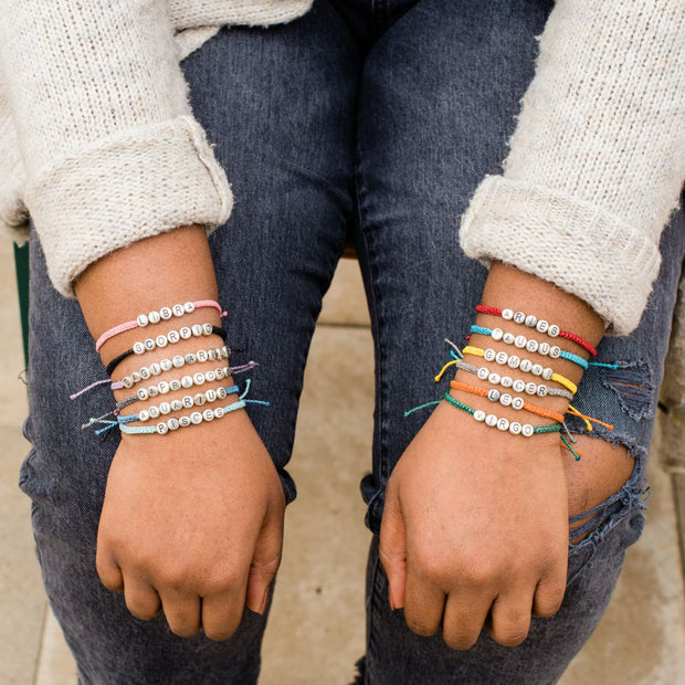 Zodiac and Element Bracelets shown on model in two arms