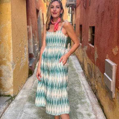 Mata Traders Sofia Midi Teal Ikat dress on a model displaying hidden pocket