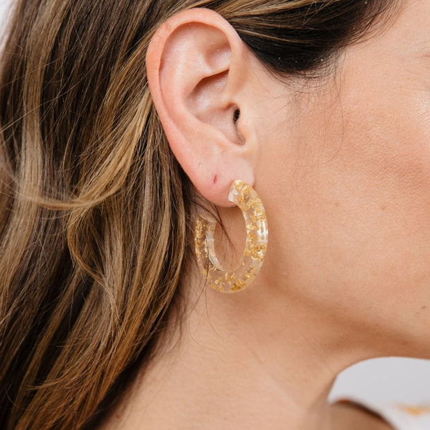 Goa Clear Resin Hoop Earrings with Gold Flecks on model