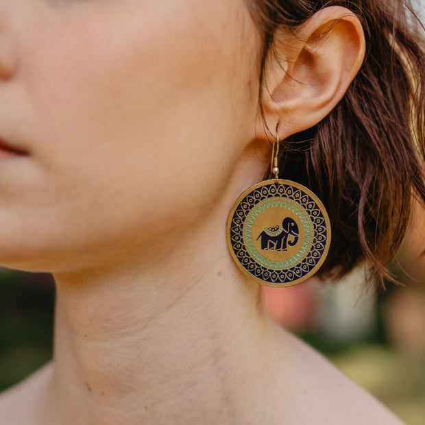 Treasure Elephant Trunk Disk Earrings on model