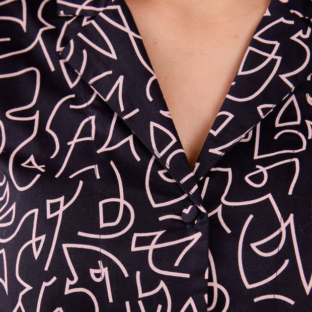 Mata Traders Camp Shirt - Black Lines on model close-up detail of print