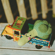 Pebble Child Friendly Broccoli Rattle styled on a farmer's truck