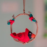 Cardinal nestling inside a miniature wreath styled