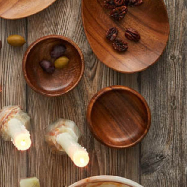 Small Acacia Wood Snack Appetizer Bowls on a table in use
