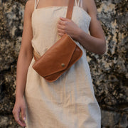 Belt Bag in Camel Leather on model wearing it in the front