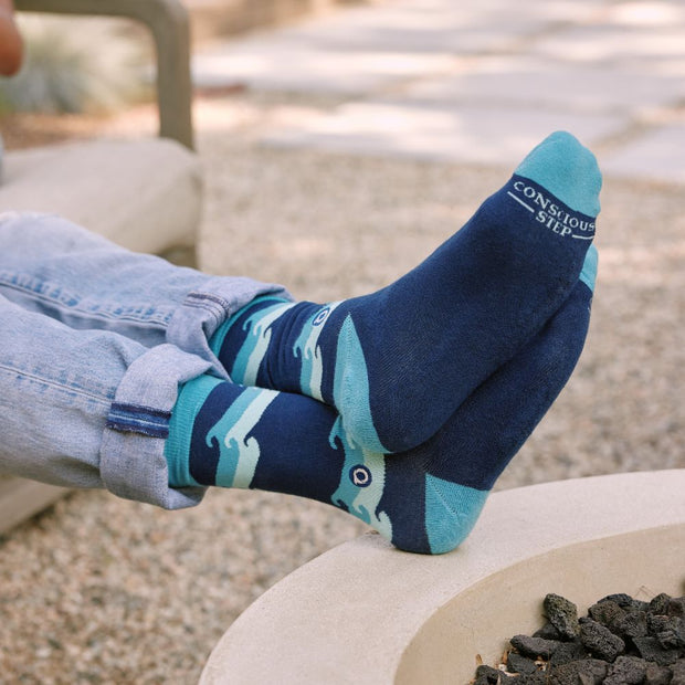 Conscious Step Socks that Protect Oceans blue on model