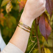 You Already Have What It Takes Cuff - Brass on model wearing other bracelets
