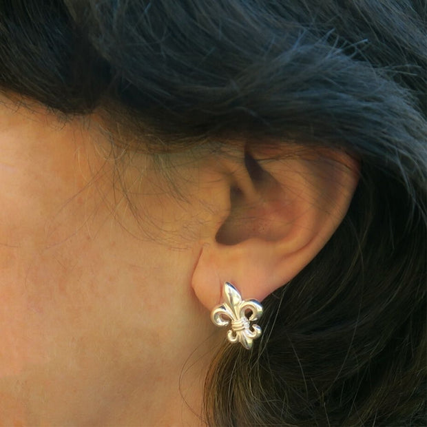 Fleur de Lis Sterling Silver Stud Earrings on model