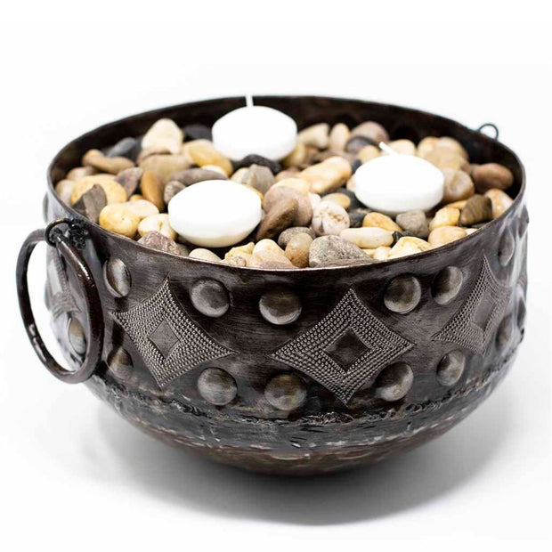 Hammered Recycled Metal Bowl with Round Handles filled with pebbles and votive candles