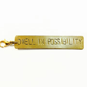 Dwell in Possibility Brass Charm