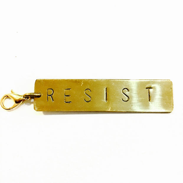 Resist Brass Charm