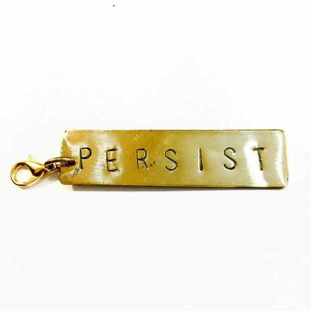 Persist Brass Charm