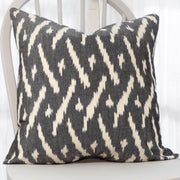 Ikat Fabric Driftwood Throw Pillow shown on a chair