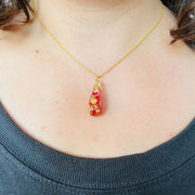 Resin Teardrop Pendant Necklace with Rose Petals and Gold Leaf accents on model