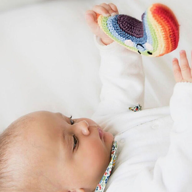 Pebblechild Hand Crocheted Friendly Rainbow Rattle with baby