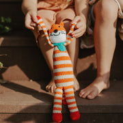 Kids playing with a Pebble Fox Rattle Toy
